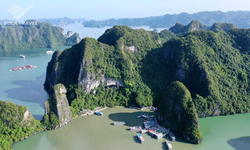 The Bo Hon Island in Halong Bay with green trees all over the island.