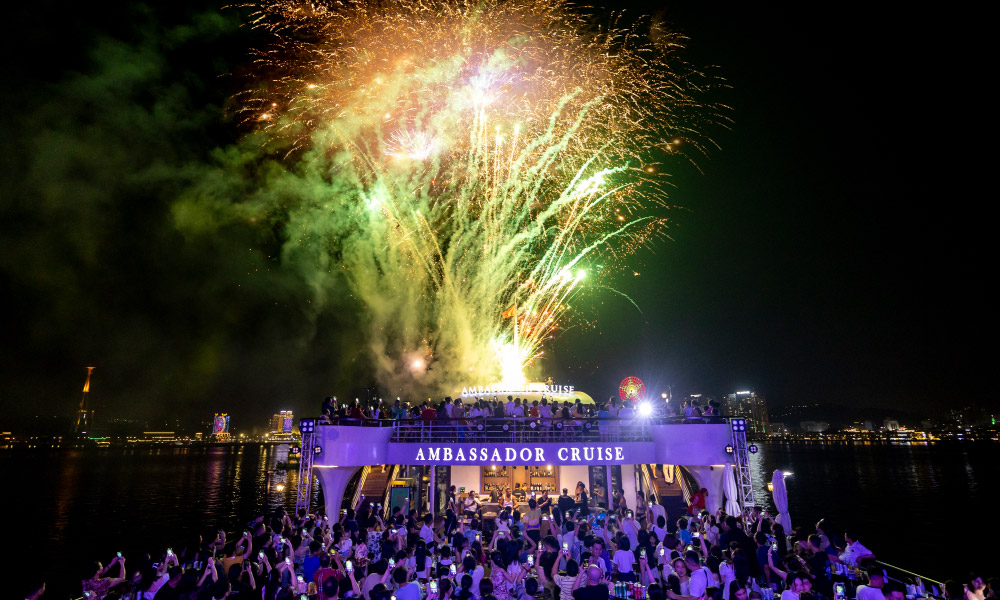 Firework shows on a cruise with many people watching.