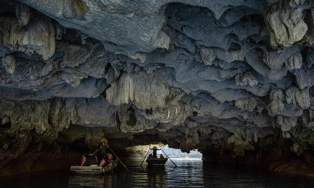 Two bamboo boats going through Luon Cave.