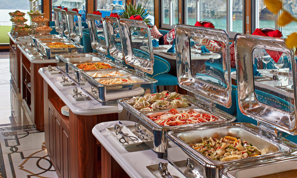 Trays of Vietnamese food on a station in a restaurant.