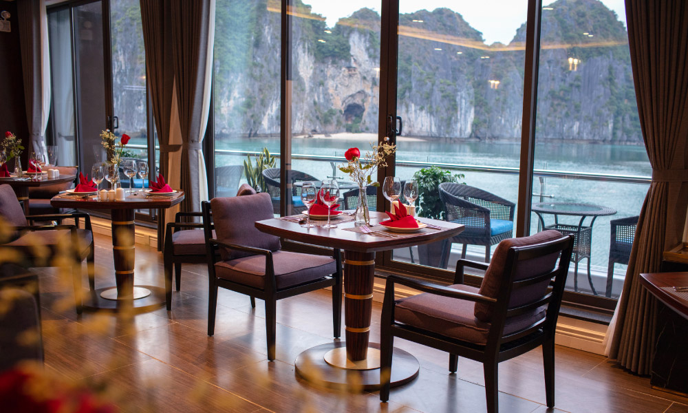 two tables in a restaurant beside a big glass window