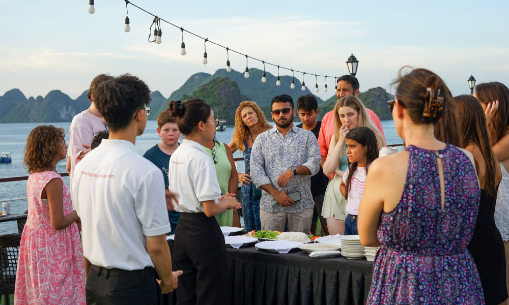 people listening to the staff in a cooking lesson