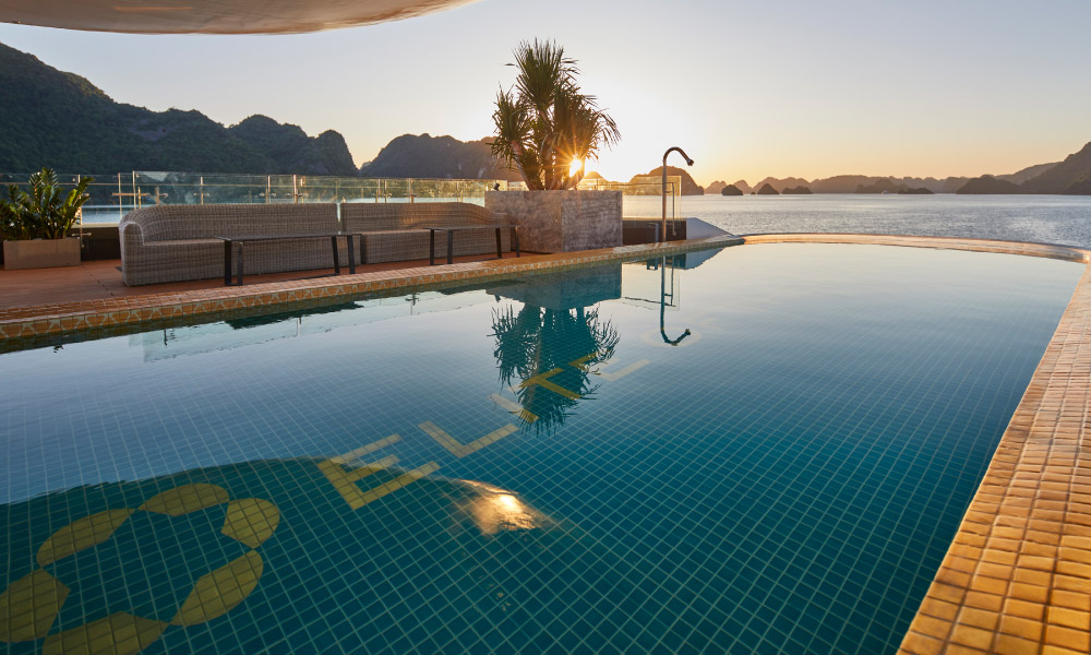 close up of a pool with view of halong sunset afar