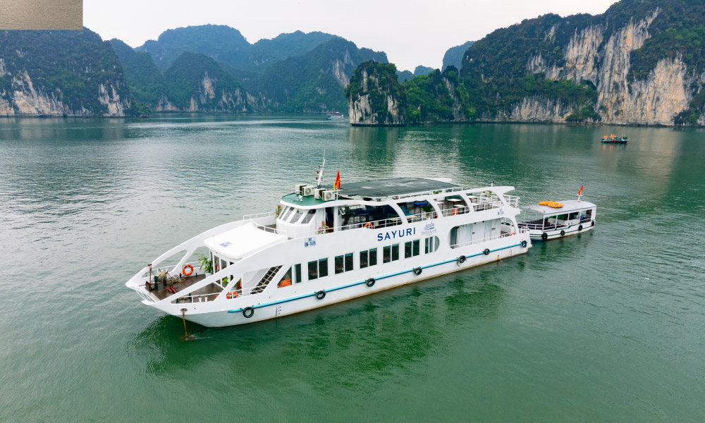 Close up of the Emeraude Sayuri Cruise in front of some islands.