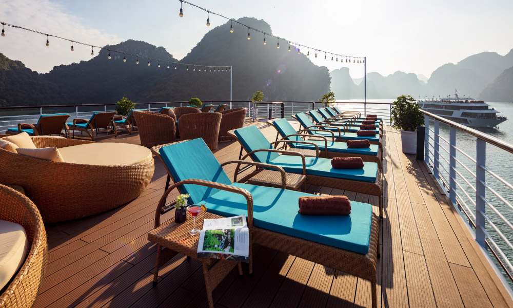 Evening view of the Capella sundeck with Halong islands behind.