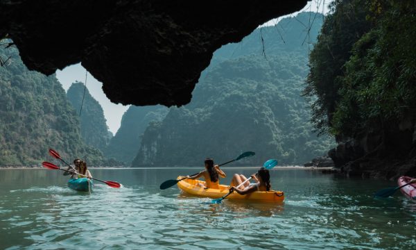 Some kayaks sailing through Luon Cave.