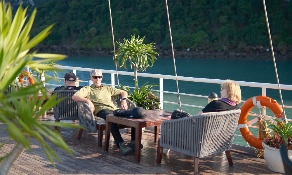 Guests lounging on the sundeck of a cruise.