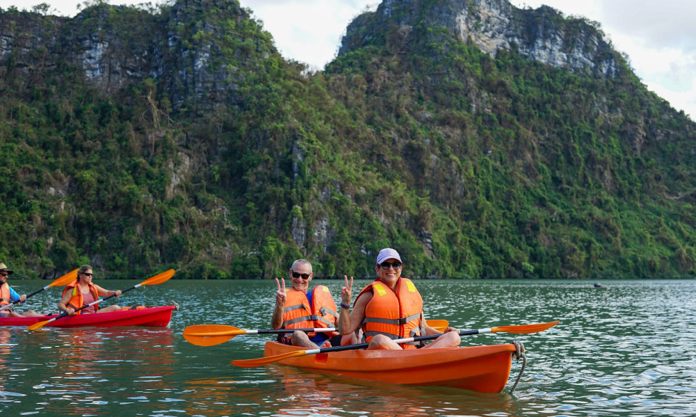 guests of peony cruise kayaking in the bay