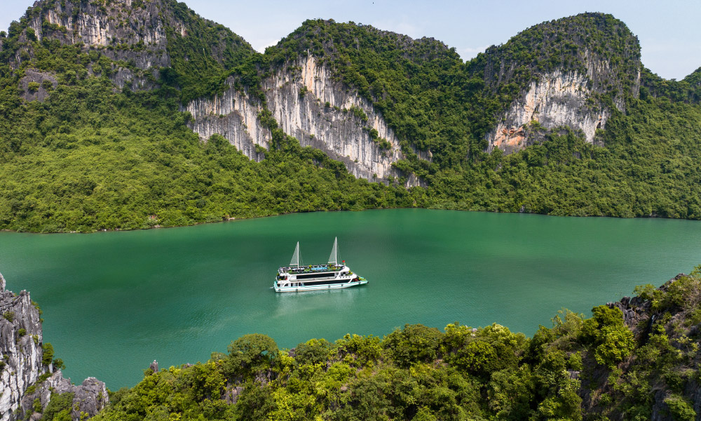 The Amethyst Day Cruise sailing in the middle of Halong Bay.