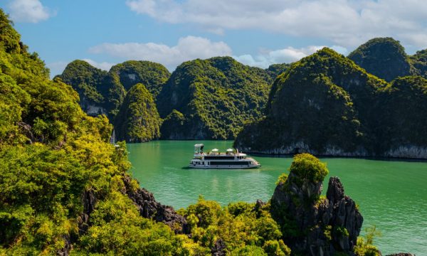 The Iris Cruise sailing among islands of Halong Bay.