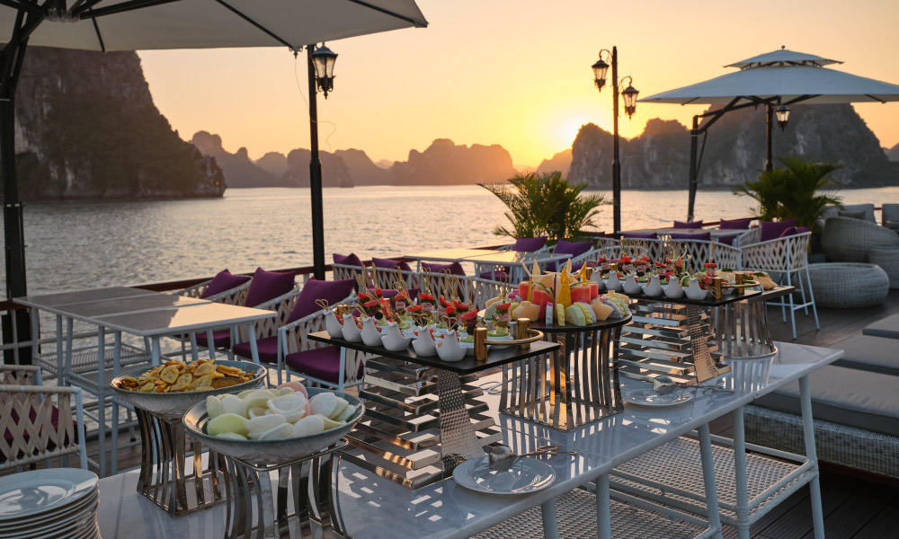 The canape dinner on the deck of Iris Cruise during sunset hour.