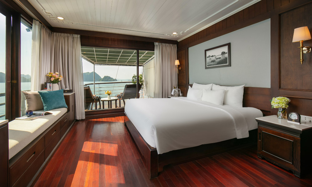 overview of mila royal suite with a double bed and large windows