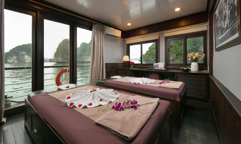 a spa room with big windows with view of halong bay