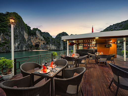 the bar and sundeck of la pandora boutique cruise during sunset