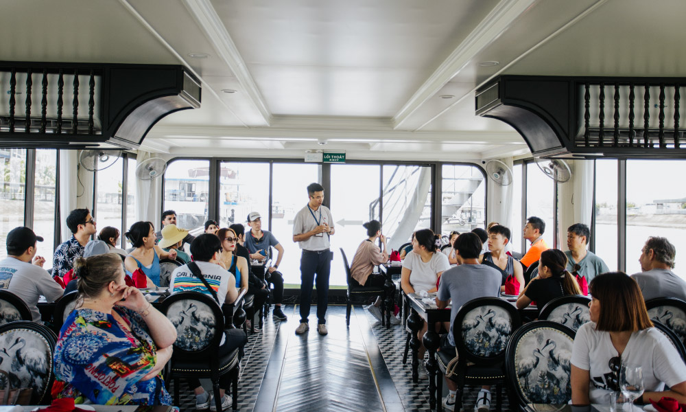 Restaurant onboard Phoenix Day Cruiser full of guests.