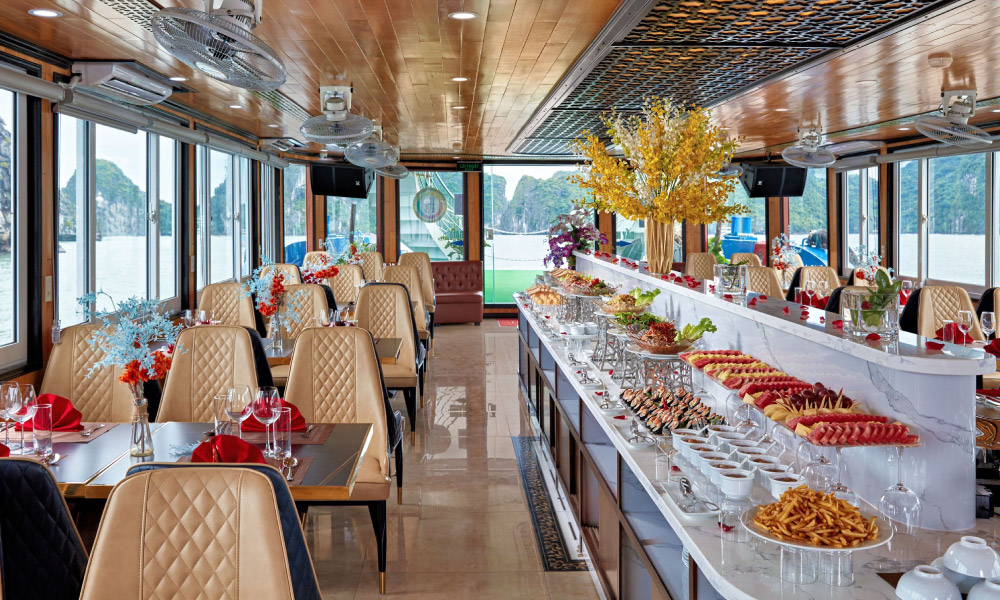 Overview of the restaurant on Cozy Bay Cruise with yellows chairs and a buffet station.