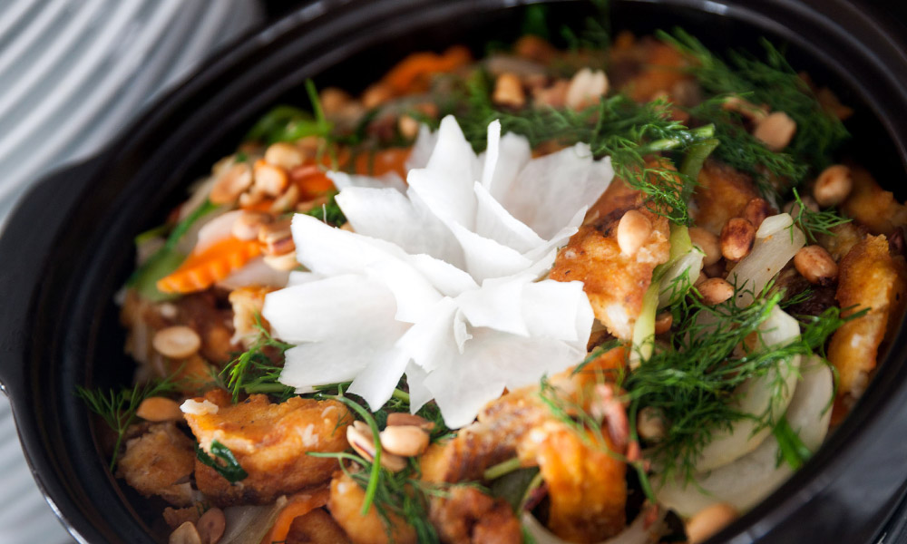 a bowl of stir fried seafood with vegetable