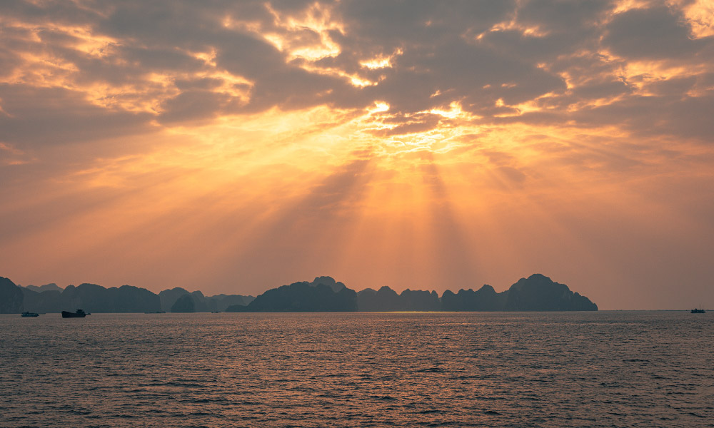 Incredible view of Halong Bay sunset through the clouds.