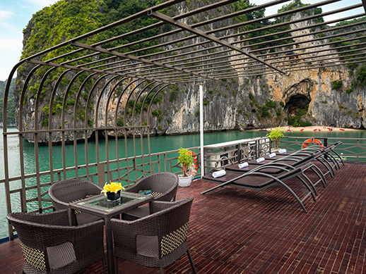 the setup of la pandora boutique sundeck with small tables and chairs with arms