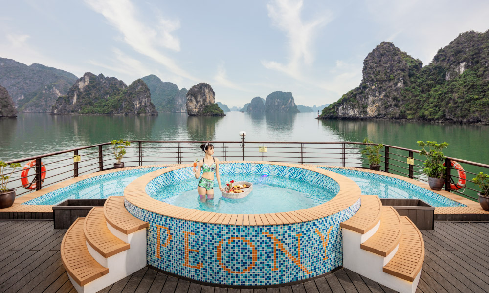 halong bay islands and the pool on sundeck of peony cruise