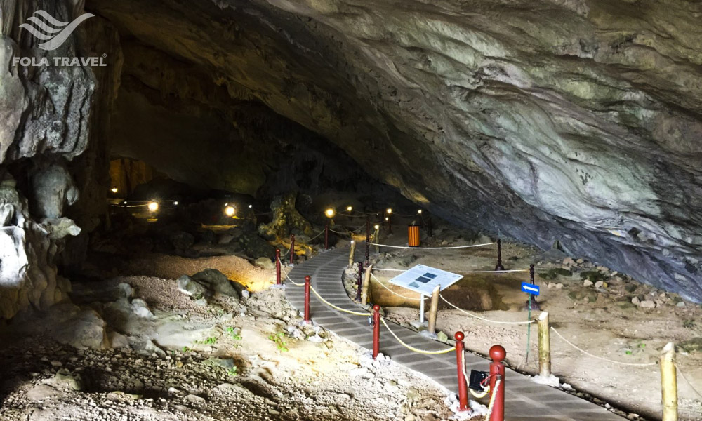 Tien Ong cave in Halong Bay with stalactites and a display area.