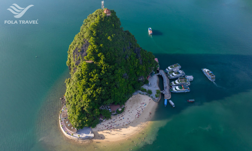 Ti Top Island in Halong Bay looking from above with some cruises dock.