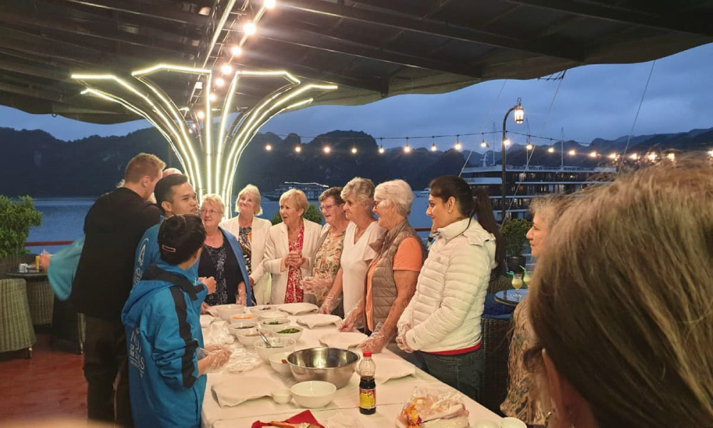 aqua elegance cruise guests enjoy vietnamese cooking lesson