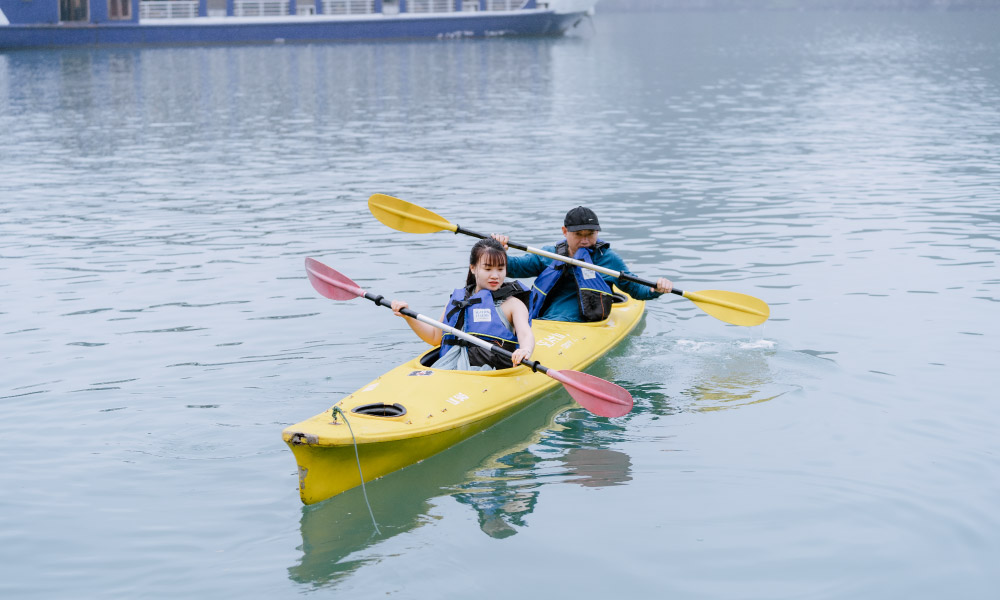 a couple on a kayak in the bay