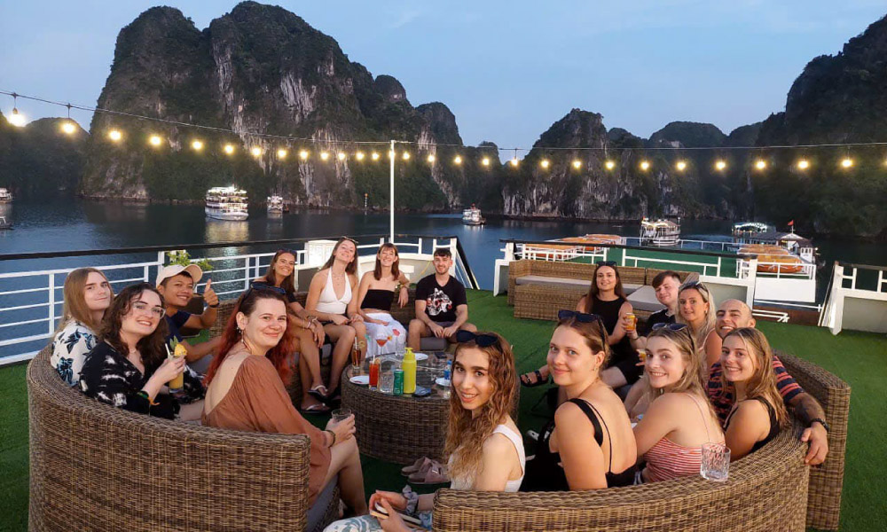 aqua elagance guests during sunset hour on the deck