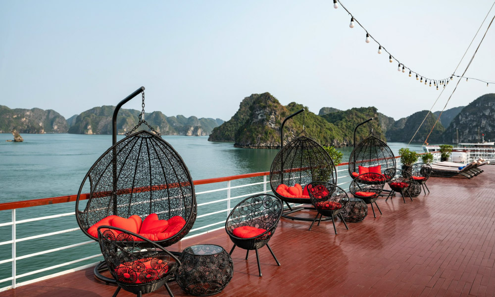 chairs on aqua of the seas deck with heart pillows