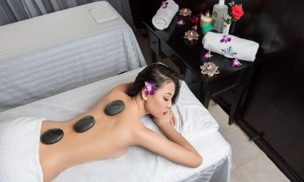 a girl receiving spa treatment on Aquamarine Cruise