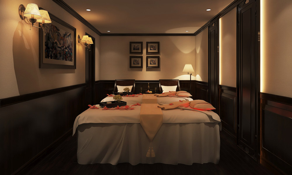 A small spa room with dim light and two parallel beds.