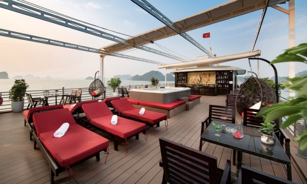 Athena royal sundeck with rows of red lounge chairs.