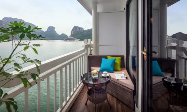 The verdure lotus luxury cruise with Halong Bay islands behind.