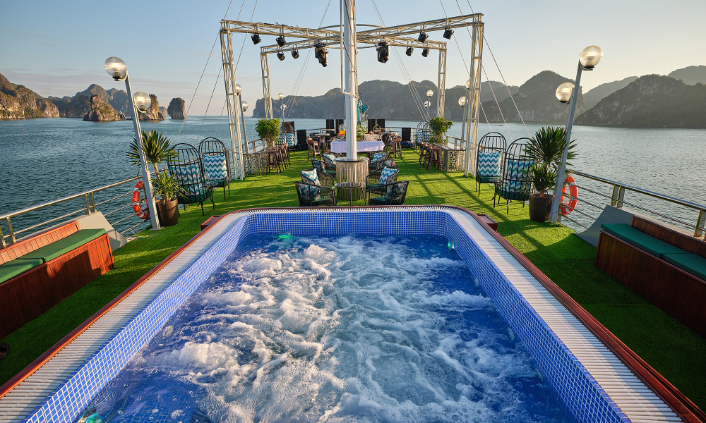 Close up of a jacuzzi looking out to the sundeck with Halong Bay view.