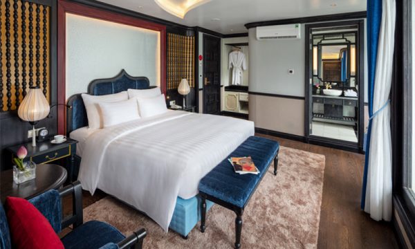 The verdure lotus luxury cruise with Halong Bay islands behind.