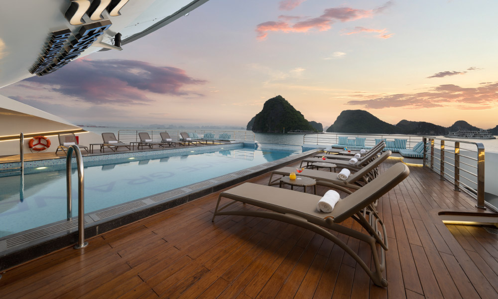 side view of the sundeck with lounge chairs and pool