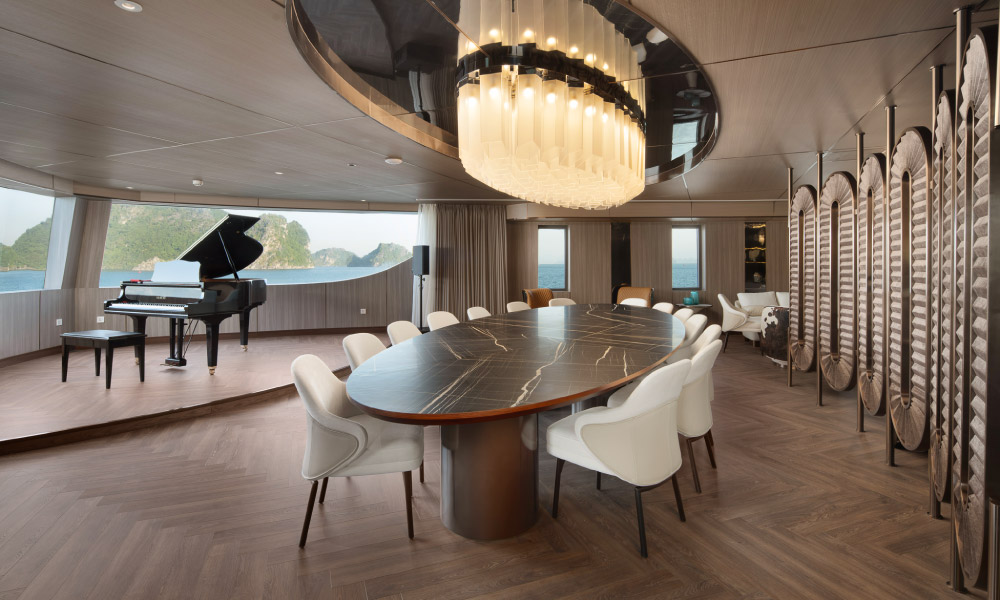 the private dining table with piano and open view to halong bay