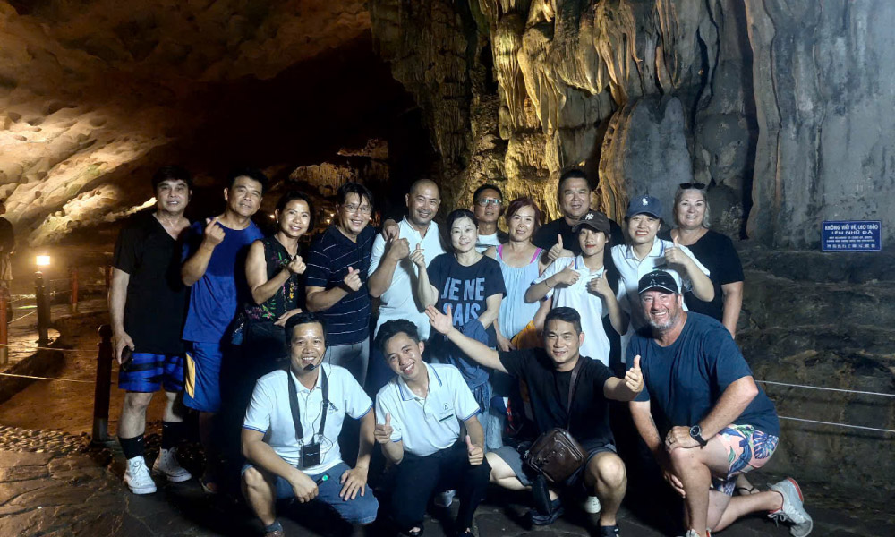 aqua elegance halong guests visiting caves