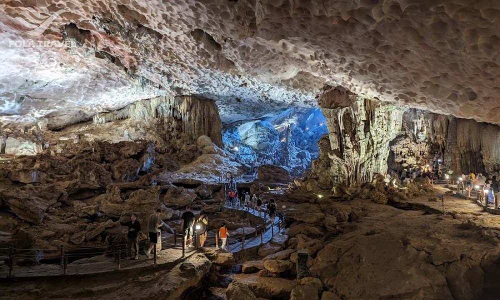 Overview of Dau Go Cave with some tourists in there.