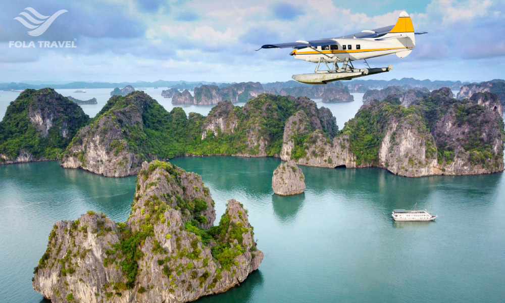 Halong Bay islands with a hydroplane flying above.