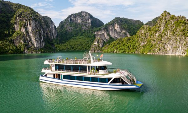 The Hercules Luxury Cruise in front of Halong Bay islands.