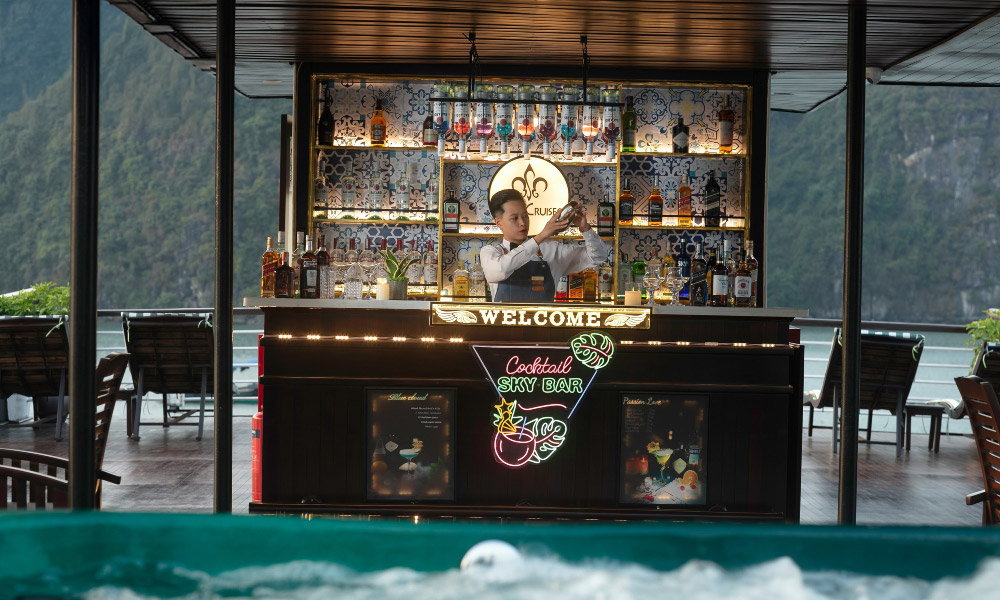 a bartender making drink at the bar