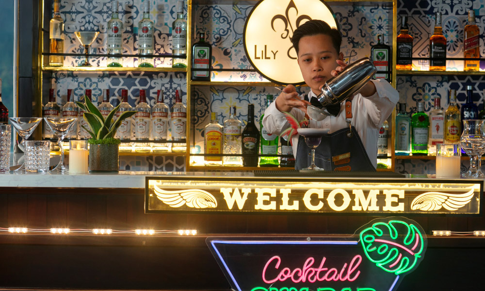 close up view of a bartender at the bar on lily cruise