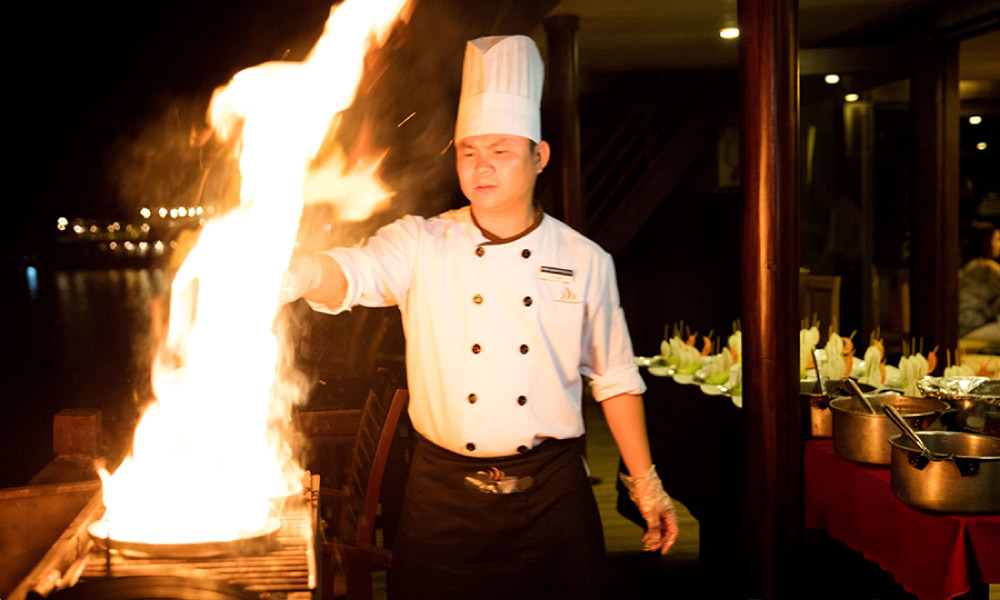 a chef of Lily Luxury cruise making dinner