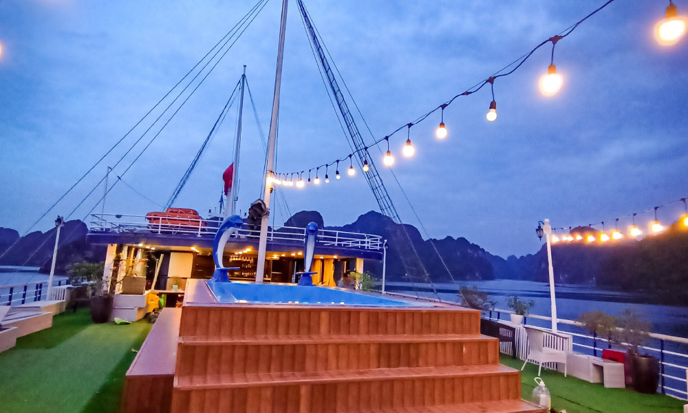 Halong nighttime on a sundeck with fairy lights.