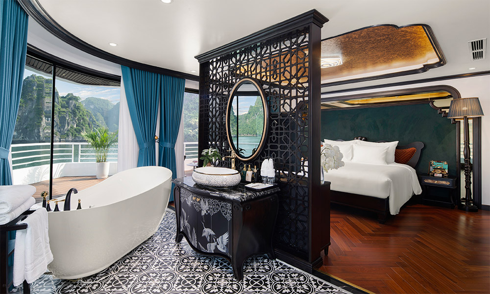 Royal room on Catherine Cruise with open bed and bathroom, separated by a divider.