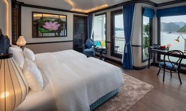 The verdure lotus luxury cruise with Halong Bay islands behind.