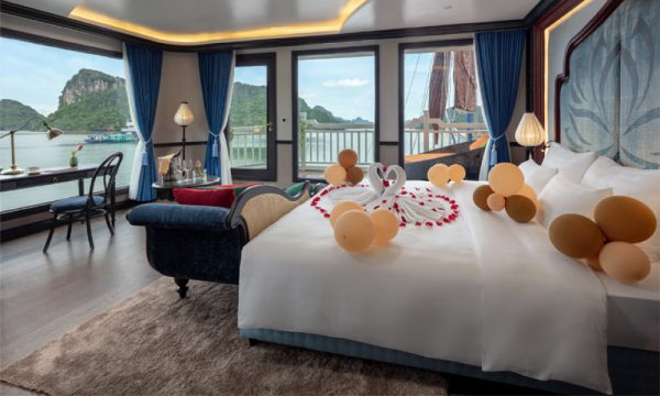 The verdure lotus luxury cruise with Halong Bay islands behind.