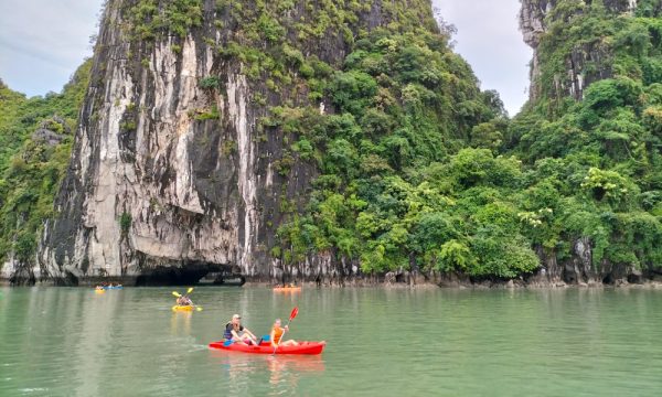 Kayaking through Luon Cave with guests of Hercules Premium Cruise.